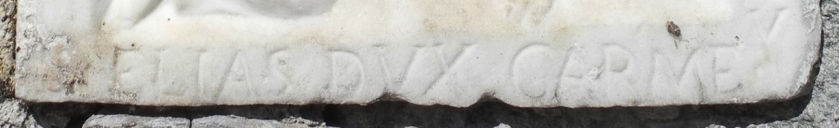 Iscrizione nella parte bassa della formella